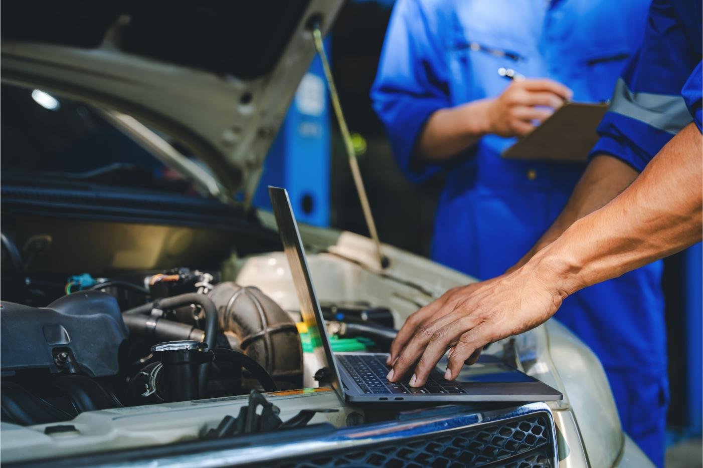 Mobile mechanic repairing a vehicle at a customer's location